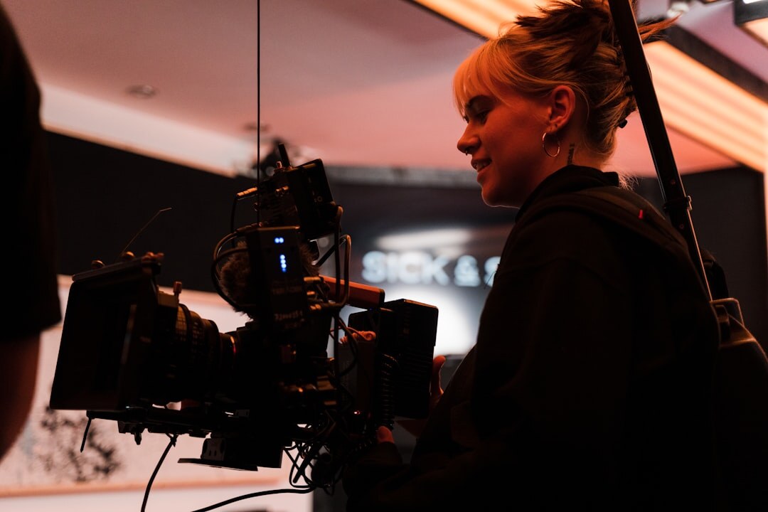 TV presenter speaking in front of camera in studio